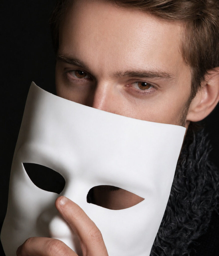 Man taking off a mask