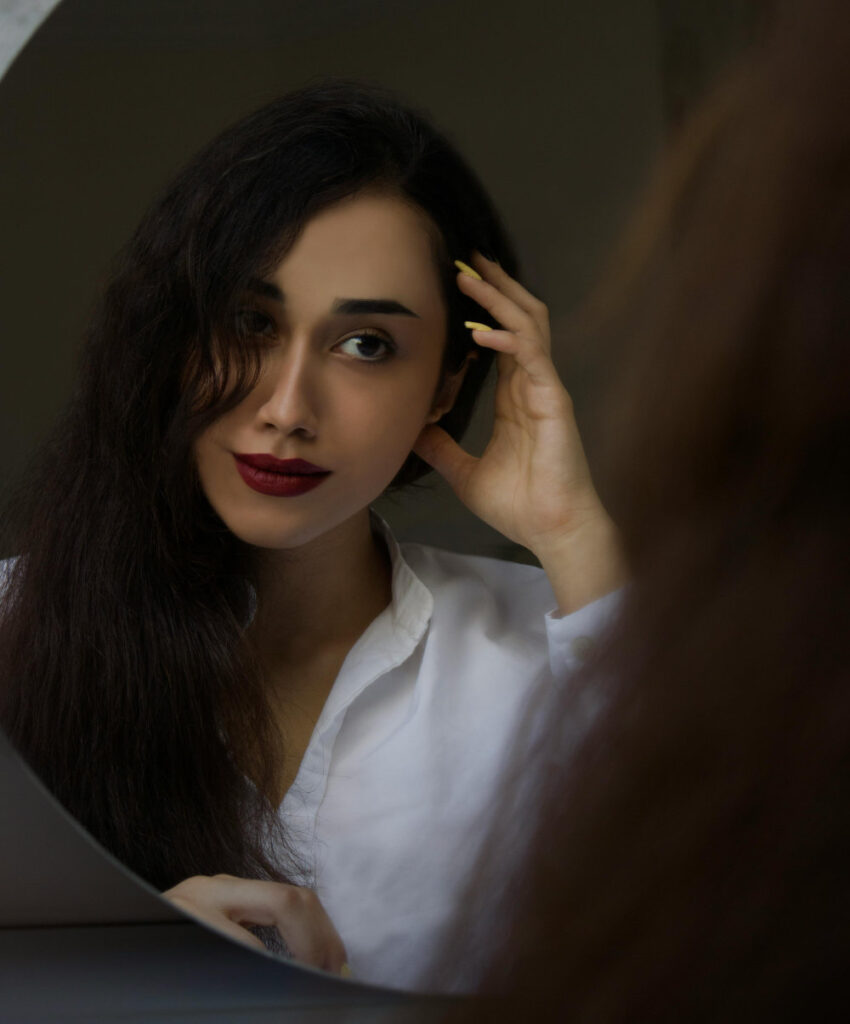 Woman looking in the mirror