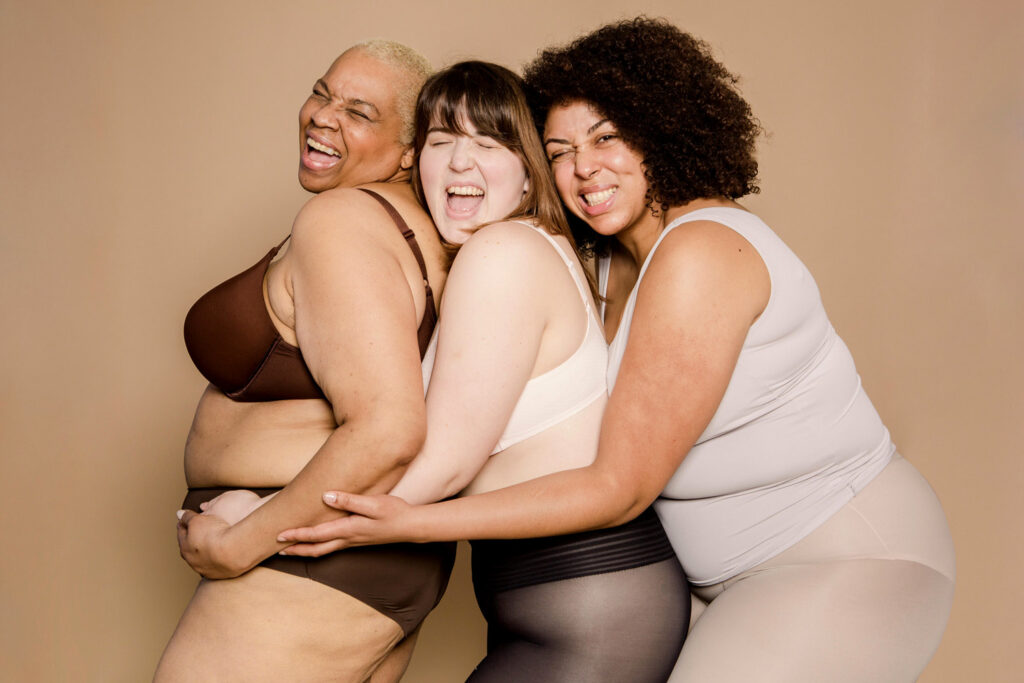 3 plus size women, having fun and being confident