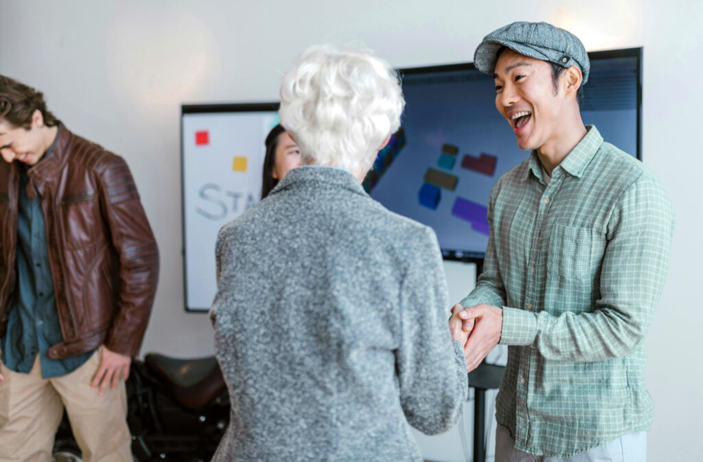 Man networking to promote his coaching business