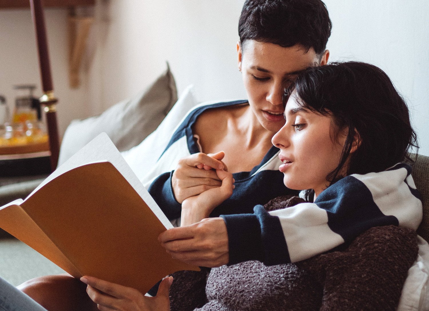 Couple doing a therapy exercise of writing and reading love letters to each other