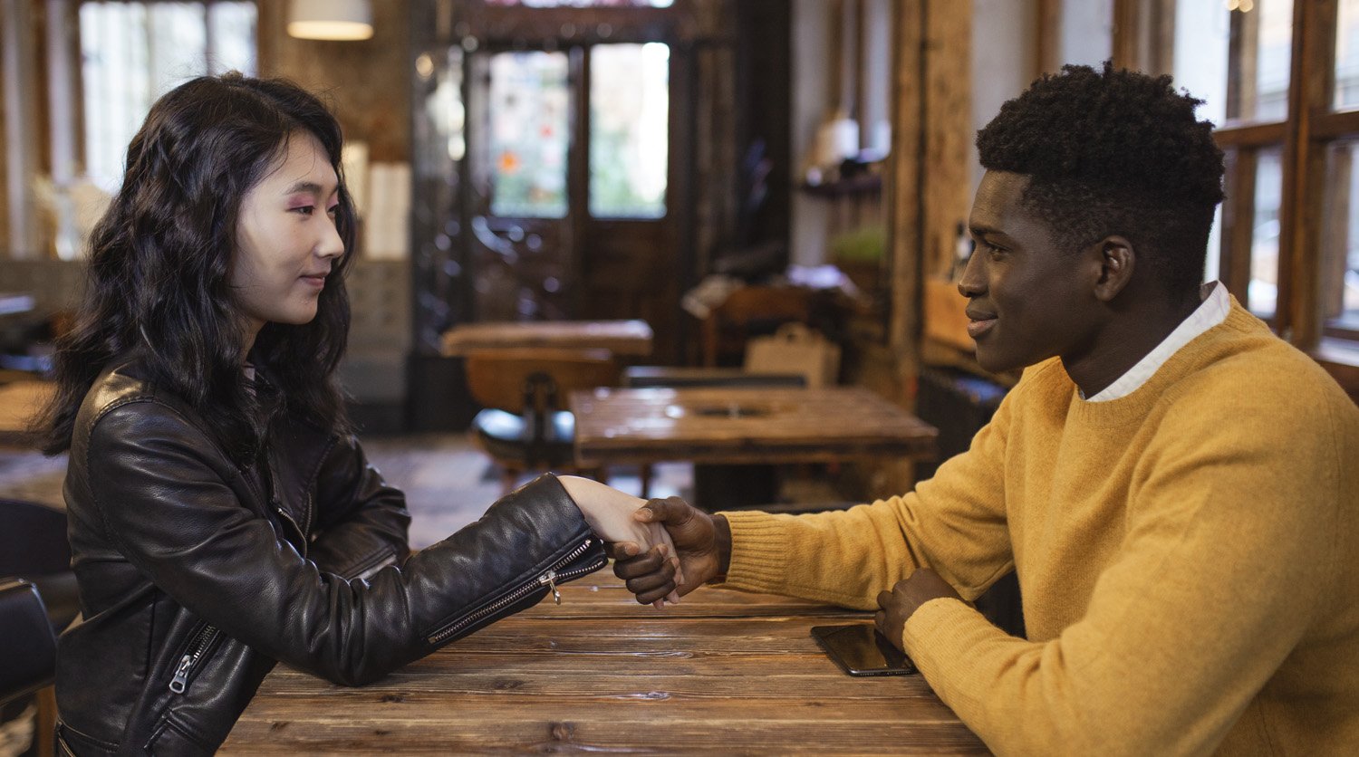 Man and woman on a date, set up by a certified dating coach