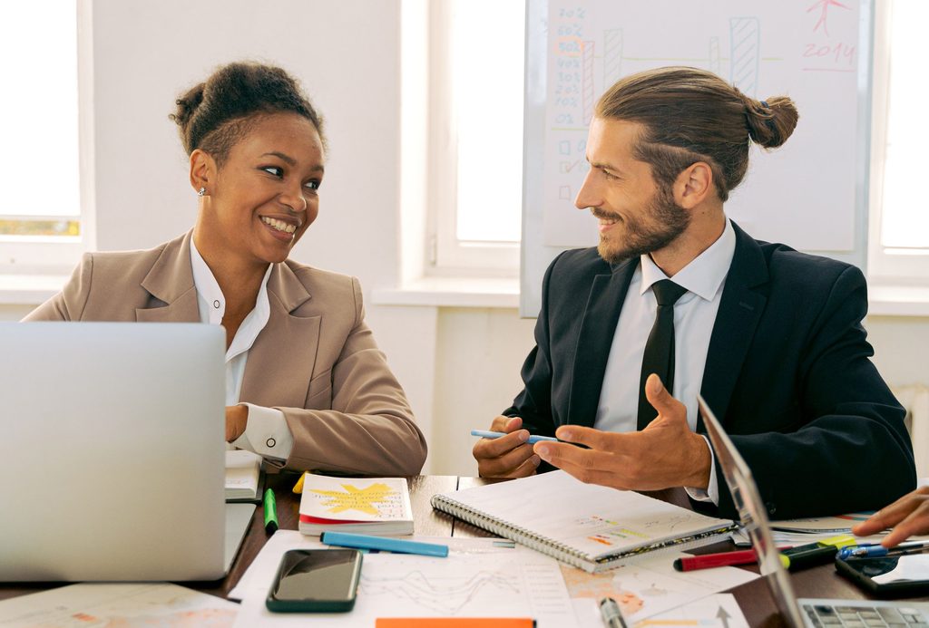 Two co-workers showing emotional intelligence communication skills