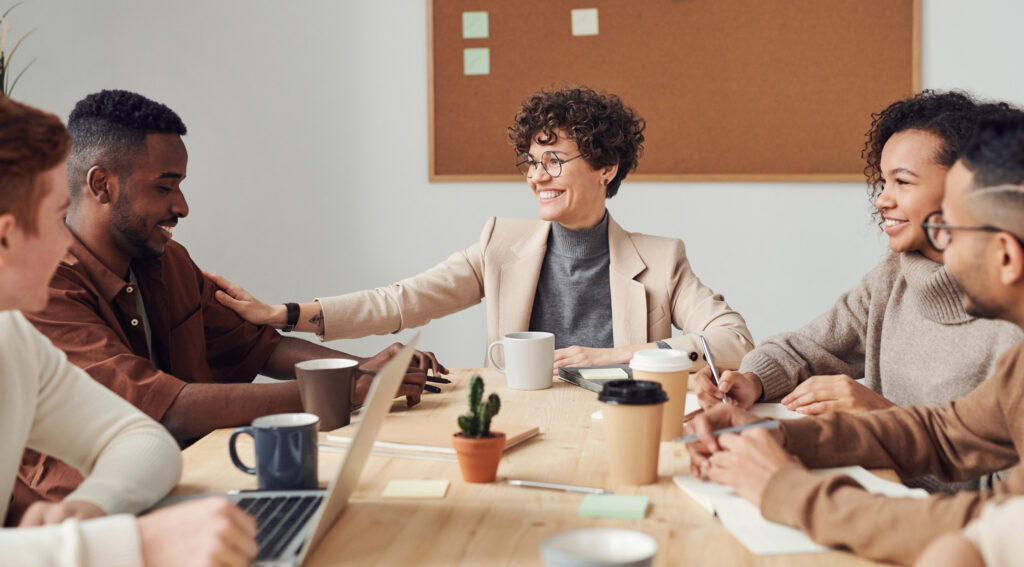 Woman showing emotional intelligence leadership skills in a business meeting