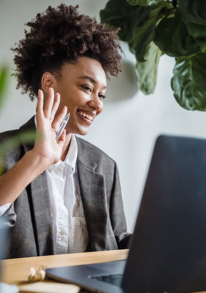 Woman in an engaged online coaching session, showing this is a job for social people