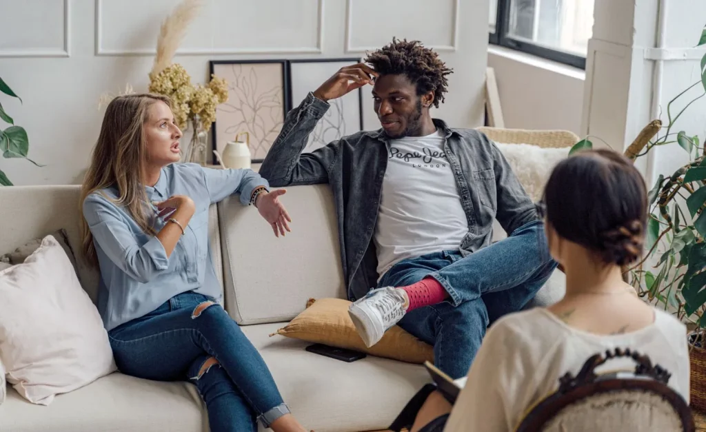 Couple on relationship coaching session, working on overcoming retroactive jealousy issues