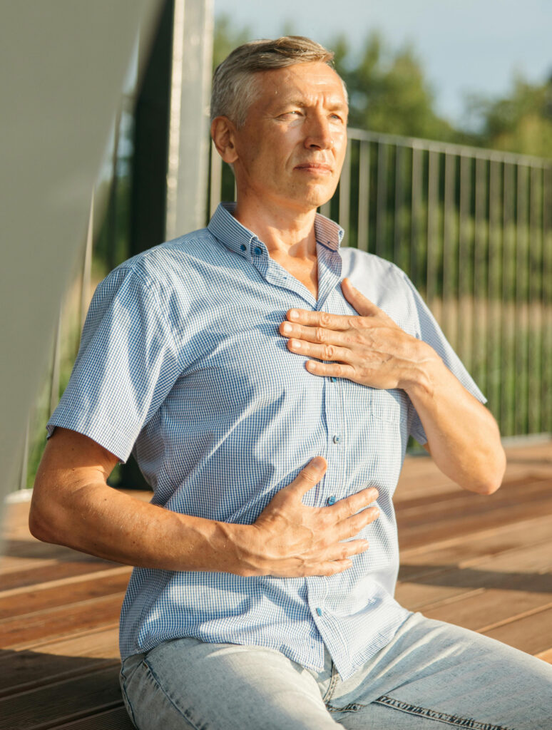 Man doing a somatic awareness practice as a somatic therapy example