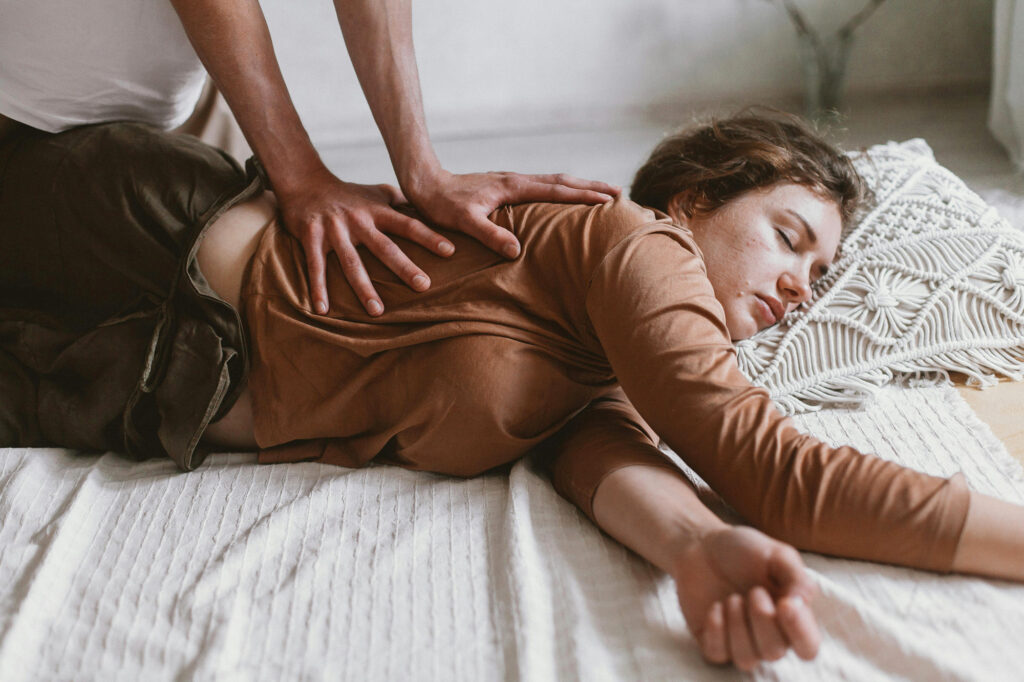 Young woman client in a somatics session with a somatic therapist