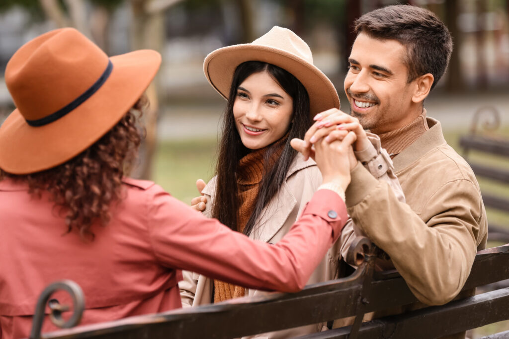 couple and woman in a polyamorous relationship