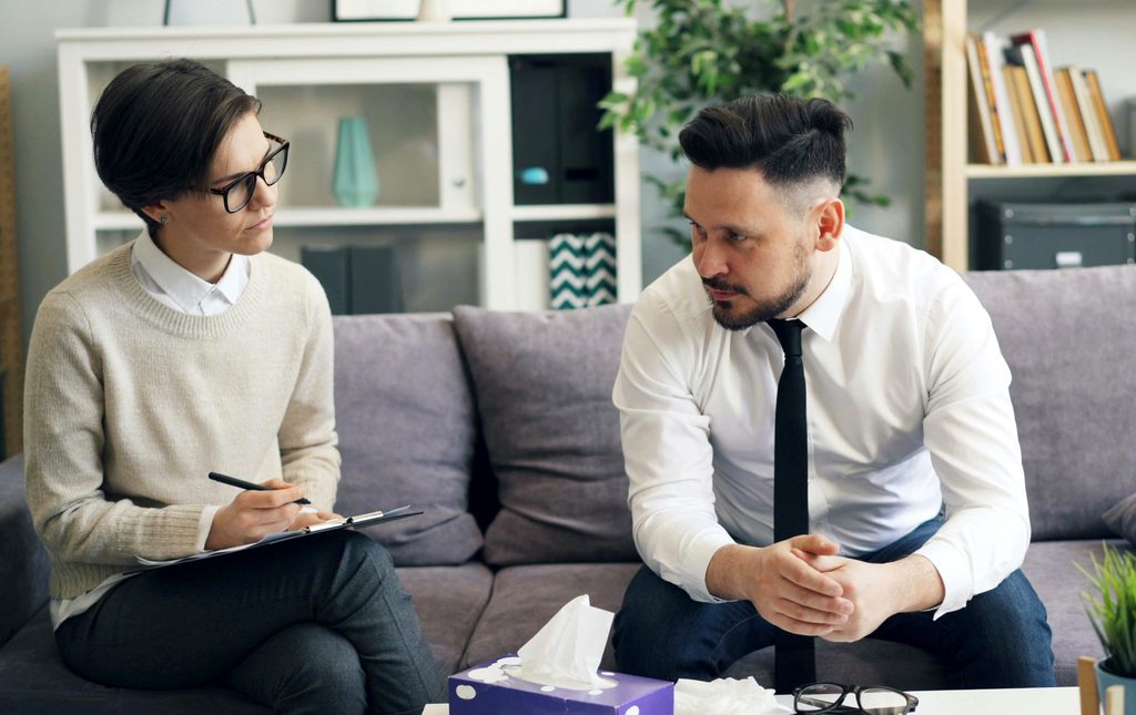 Sex and relationship coach in a session with a male client